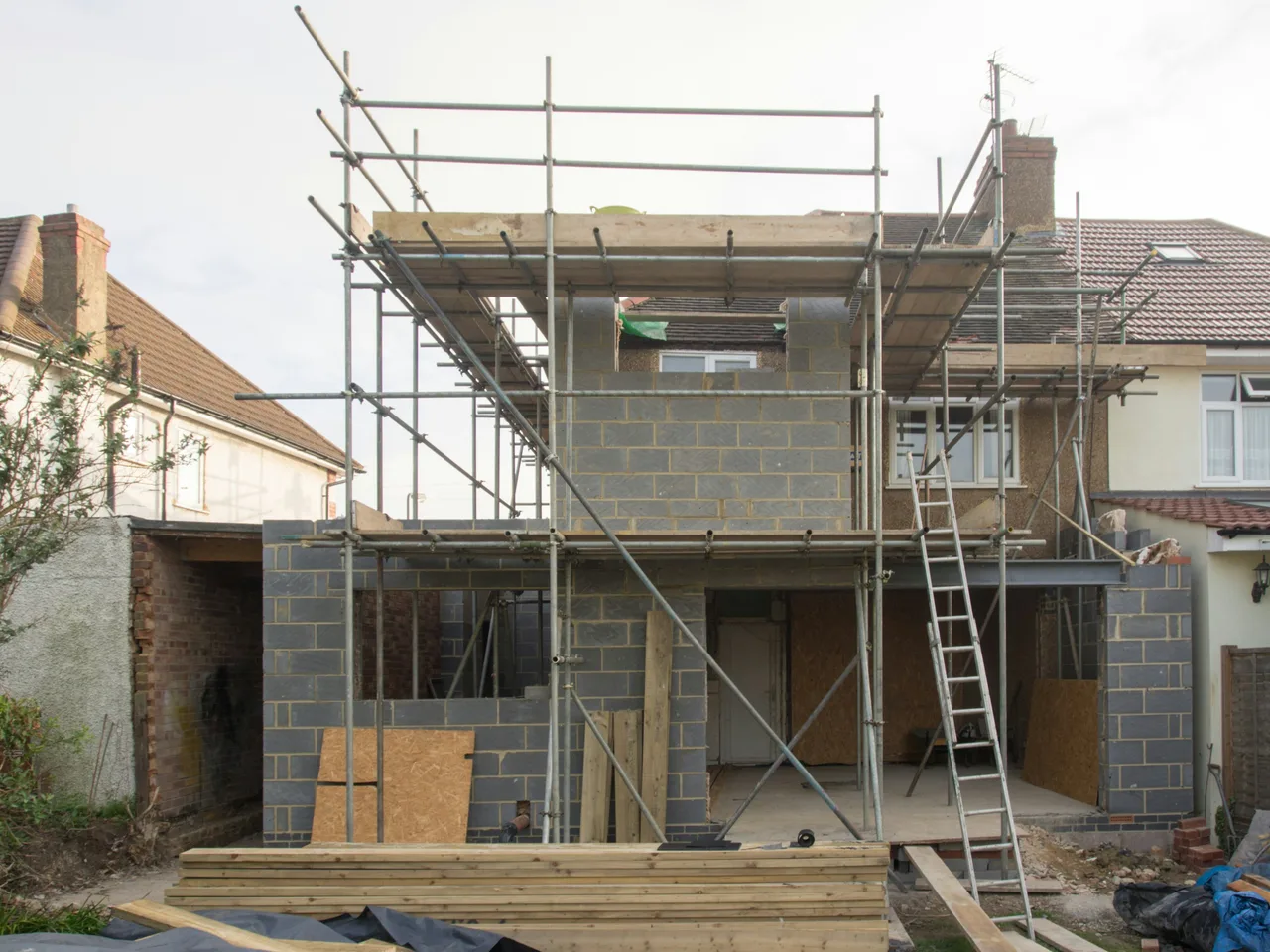 Stock photograph of brickwork and scaffolding at a residential building project in London.